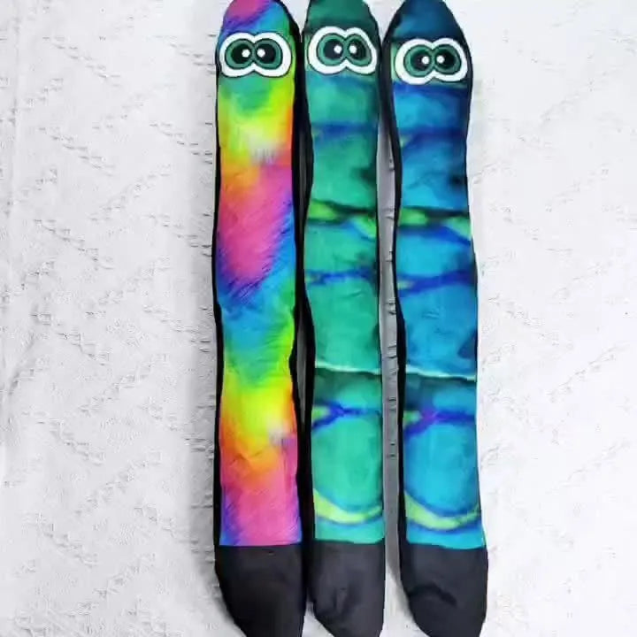 Snake-shaped plush dog squeaky toy with multicolor stripe print design