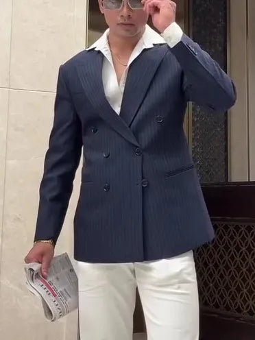 Men's striped double-breasted blazer on a hanger showing regular fit and length