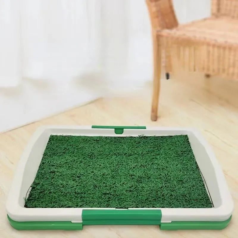 Green artificial grass dog toilet patch with plastic training tray and removable collection base.