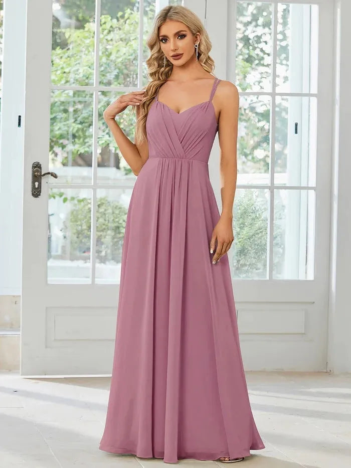 Women's light green sleeveless A-line banquet dress with long pleated skirt on a hanger.