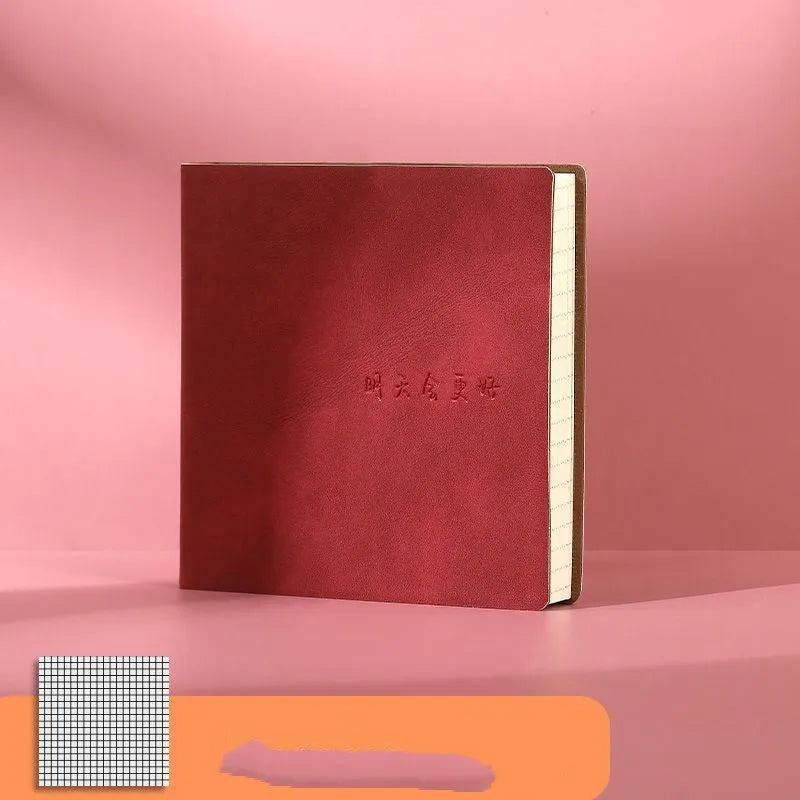 Square A5 mesh leather notebook in avocado green with French fold binding open on blank pages
