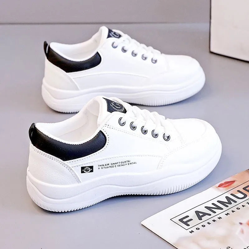 Women's white Korean-style lace-up pumps with cross straps and a flat rubber sole.