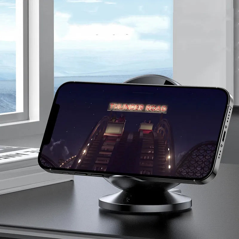 Black mobile phone wireless charging holder with integrated Bluetooth speaker showing phone display angle