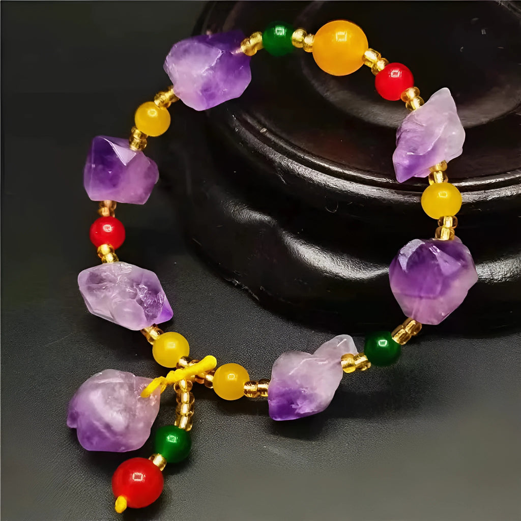 Women's natural amethyst shaped bead bracelet with a fu character charm.