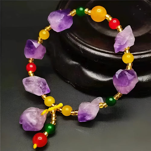 Women's natural amethyst shaped bead bracelet with a fu character charm.