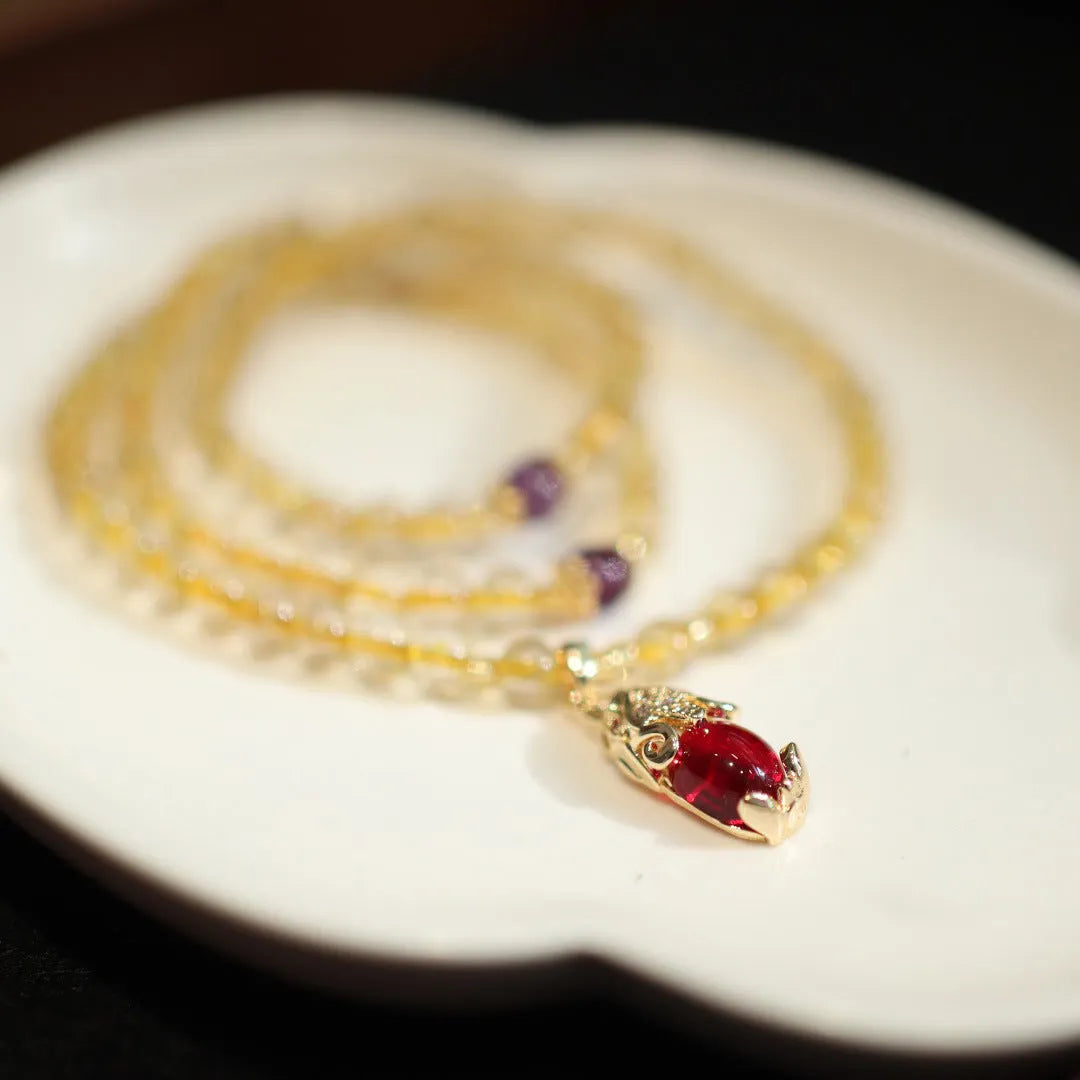 Natural rutilated quartz bracelet with gold rutile inclusions and Chinese style gold accent beads