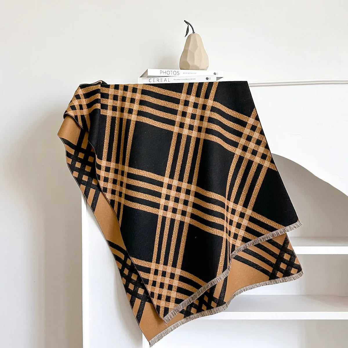 Cashmere-like scarf with tassel detailing in brown colour showing mid-length design