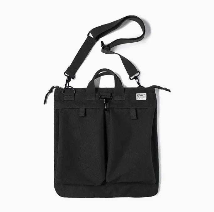 Marden Tooling military green canvas messenger bag with crossbody strap on a table