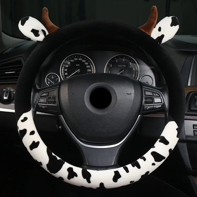 Short plush automotive steering wheel cover in black colour showing textured surface