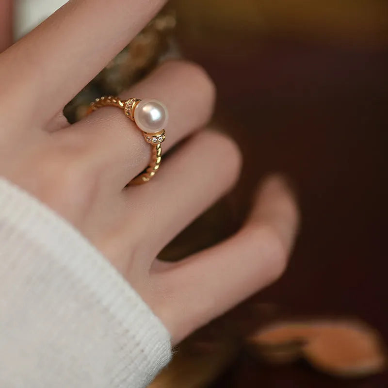 Adjustable copper pearl ring with geometric antique twist design in gold and silver finish options