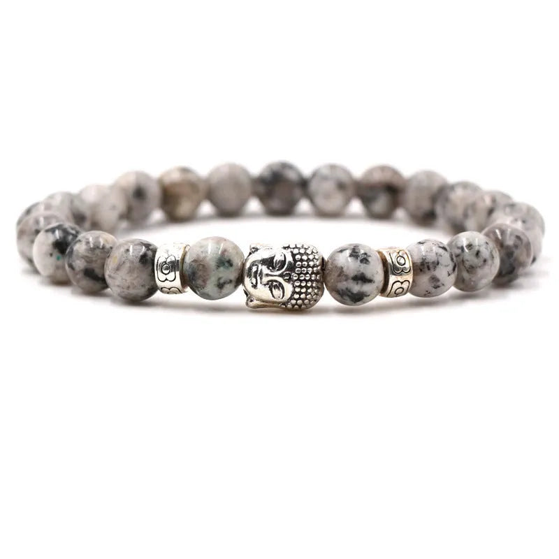 Tigereye stone Buddha head stretch bracelet with 8mm beads on a wrist.
