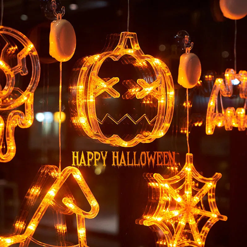 Seven Halloween-themed LED hanging lights with suction cups including spiders, pumpkins and ghosts