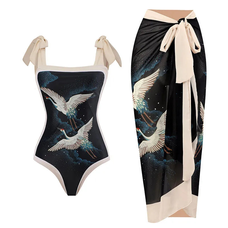 Women's yellow one-piece swimsuit with floral pattern and matching white chiffon skirt.