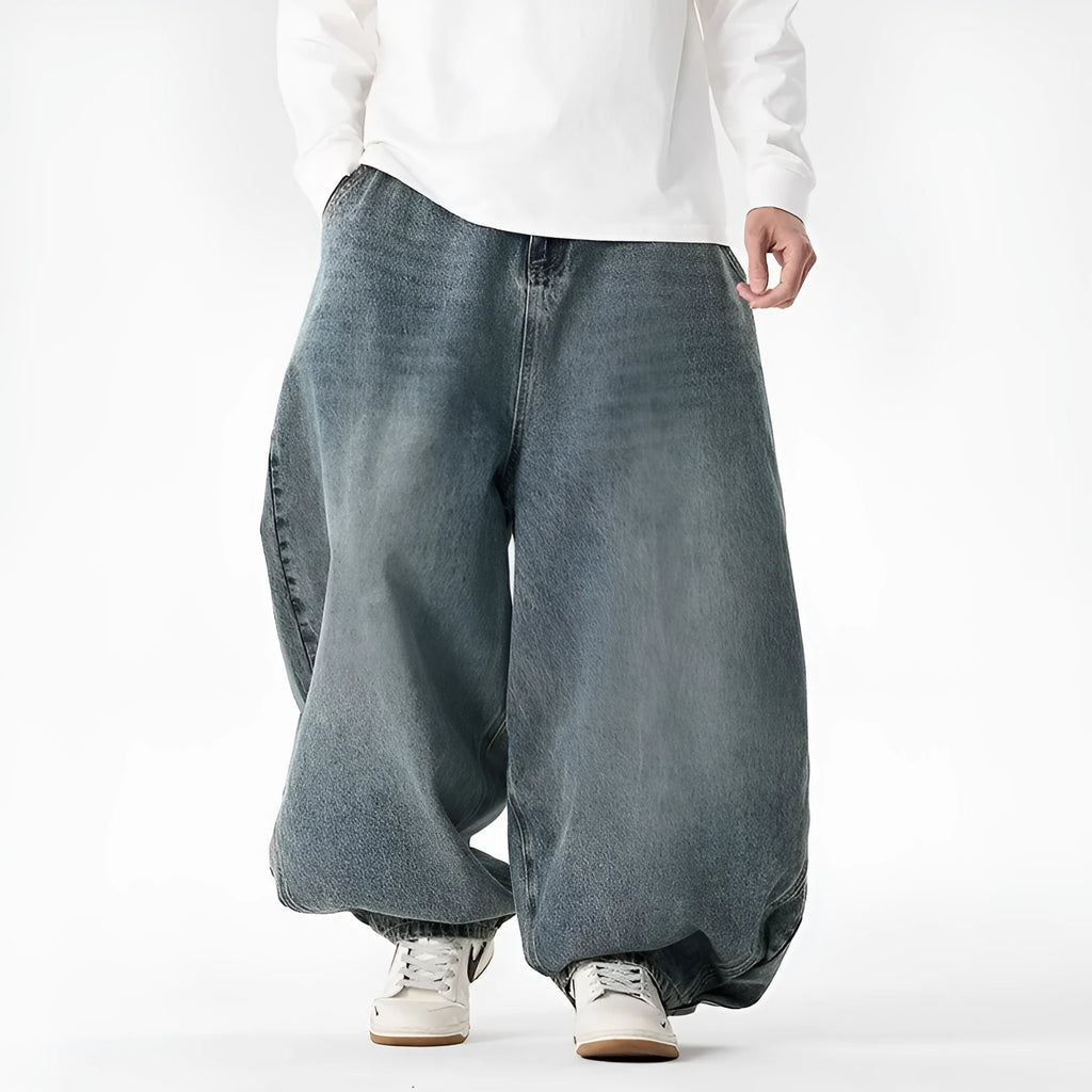 Men's plus-size light blue baggy jeans with a straight leg and zip fly
