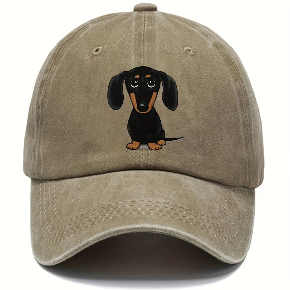 Retro washed blue cotton baseball cap with a printed dachshund design on the front and a peaked brim.