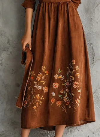 Brown polyester midi dress with vintage floral embroidery, shown in a leisure style cut.