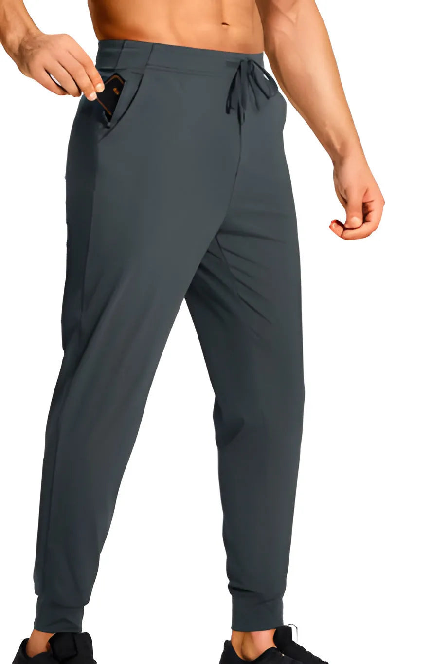 Men's loose-fitting casual polyester trousers in a solid colour on a hanger.