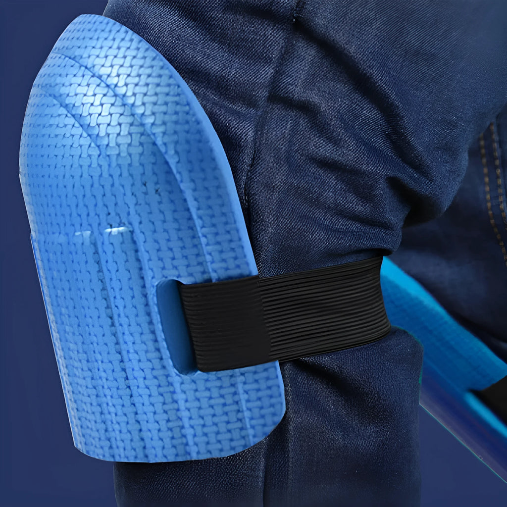 A pair of thick EVA foam kneepads in blue, shown on a hard floor surface.