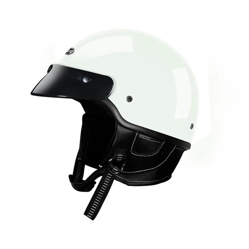 Retro open face motorcycle helmet in matte black, shown from the side on a grey background.