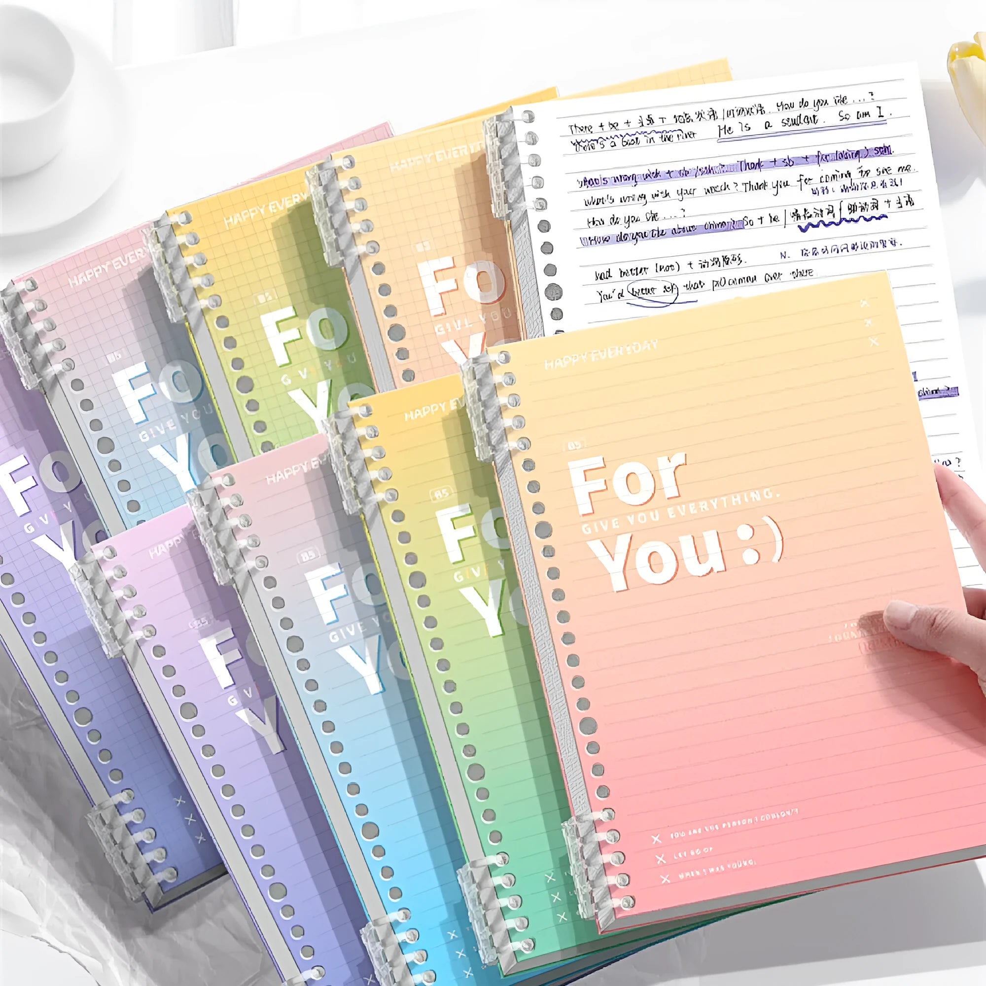 Gradient colour removable coil notebook showing spiral binding and PP cover