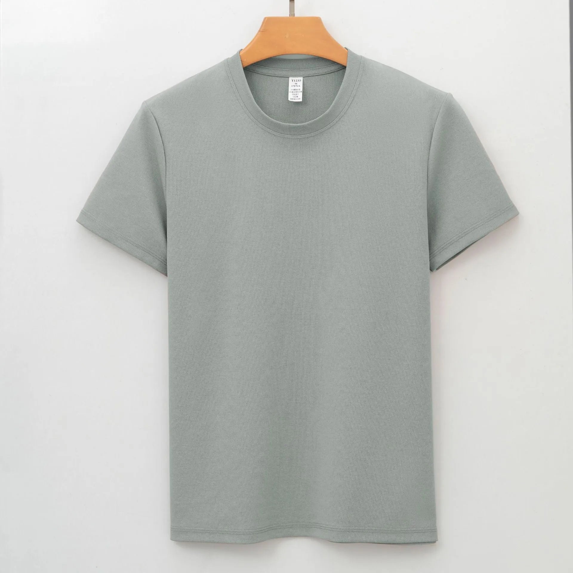 Men's beige short-sleeve antibacterial quick-dry T-shirt laid flat.