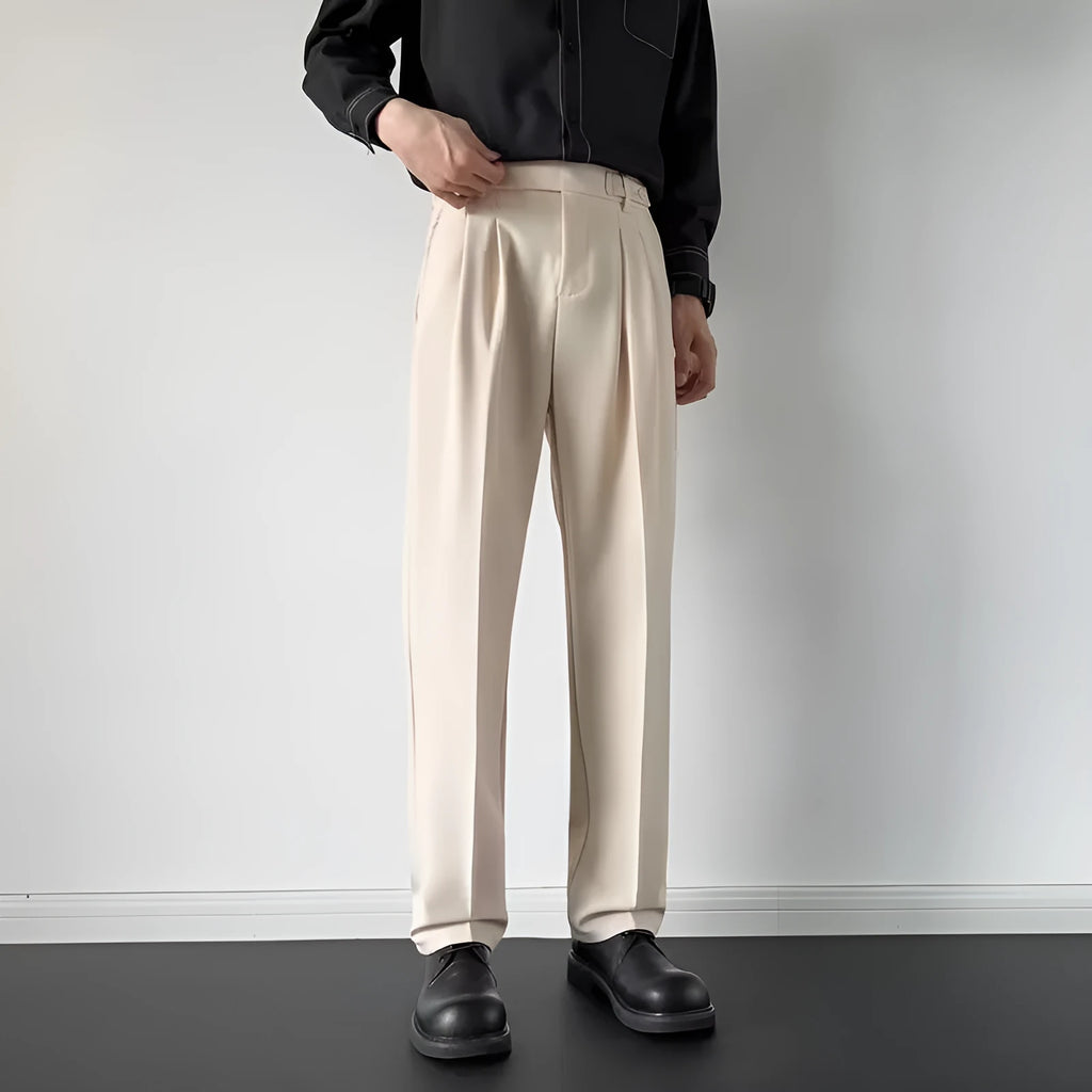 Men's straight-leg loose fit suit trousers in apricot colour on a hanger.