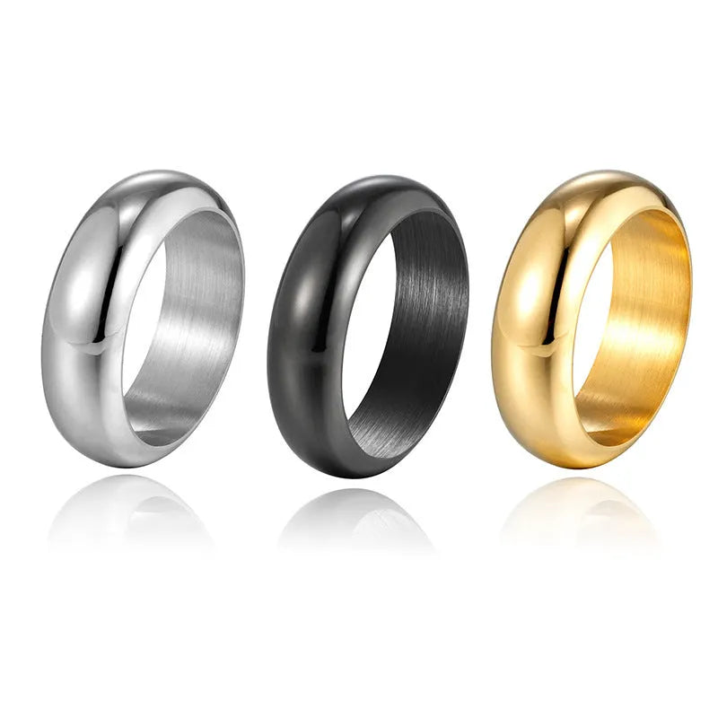 Glossy electroplated titanium steel ring in gold, black, and steel colours showing band detail