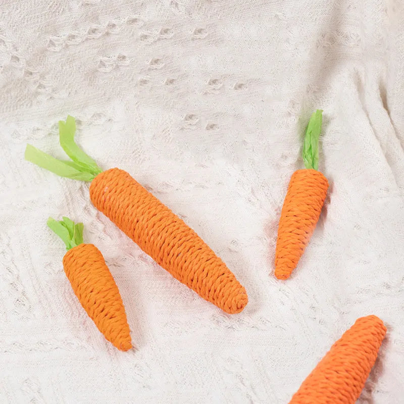 Set of cat toys including carrot bites, paper balls, ringing stones sticks, and dental chewing sticks in large and small sizes