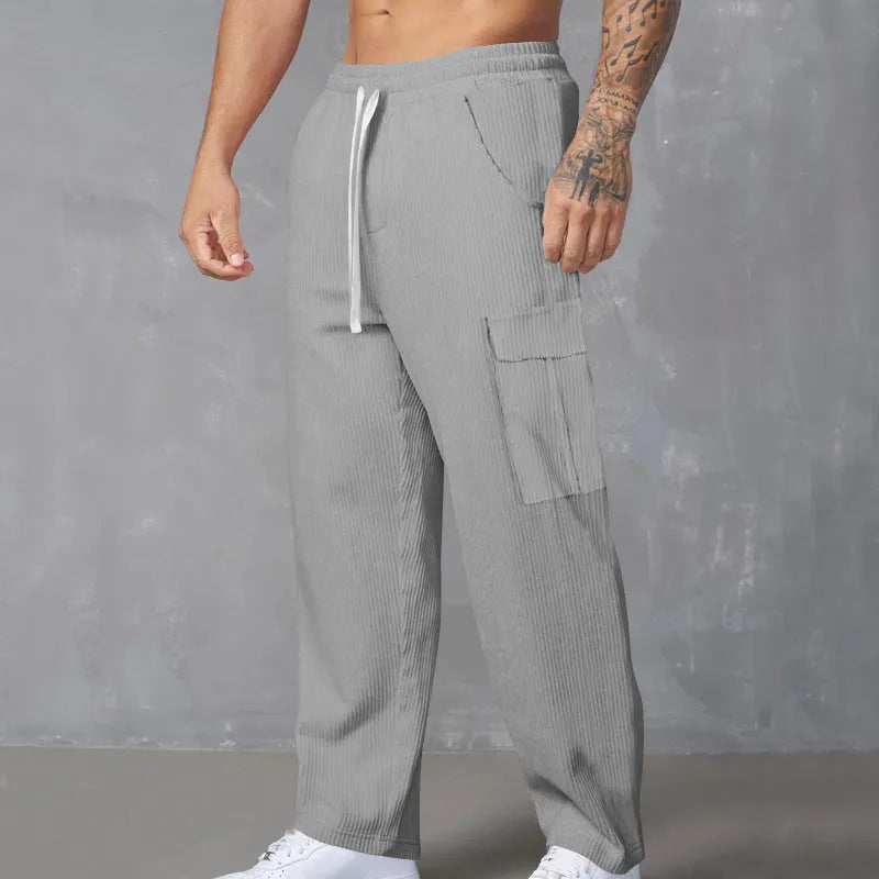 Men's straight-leg corduroy cargo trousers in navy blue with a drawstring waist.
