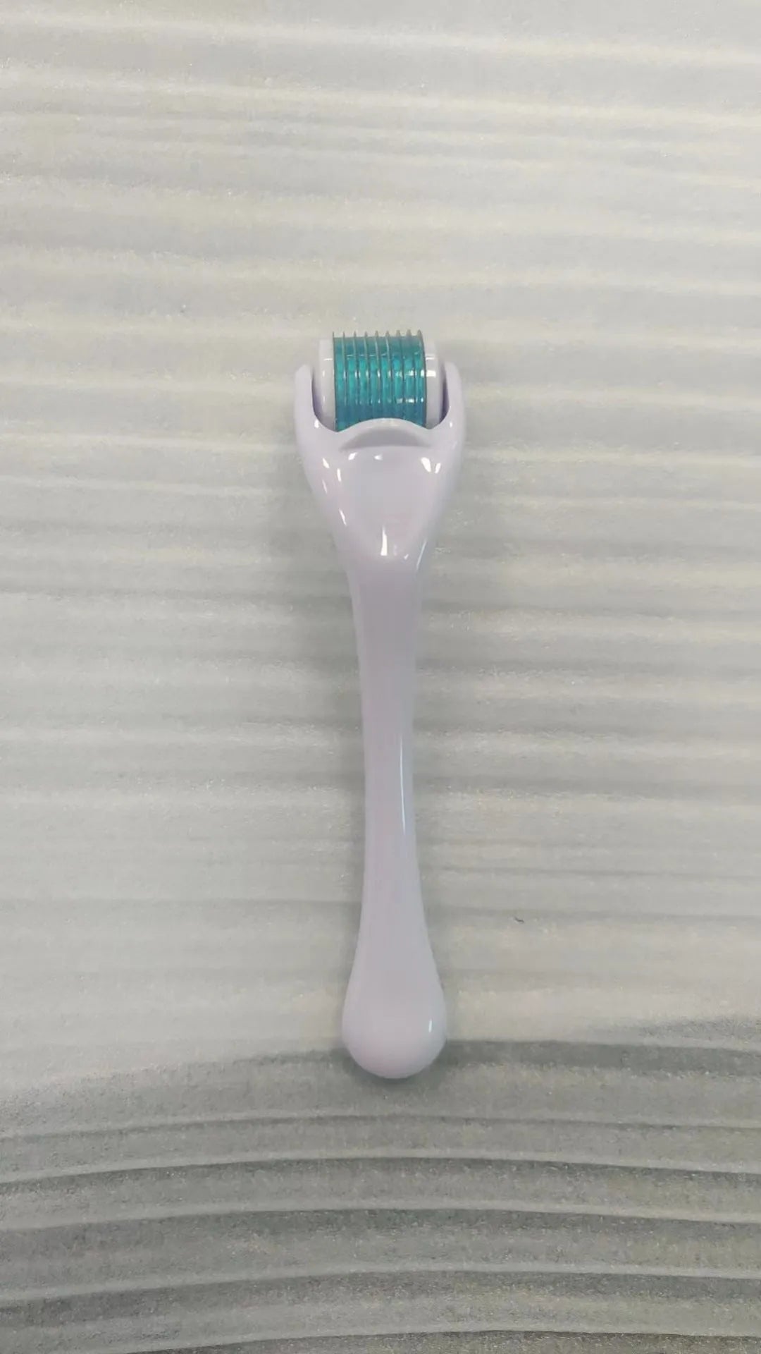 Sterile micro needle derma roller with PC handle in selected colour and 0.2mm, 0.25mm, or 0.3mm needle wheel.