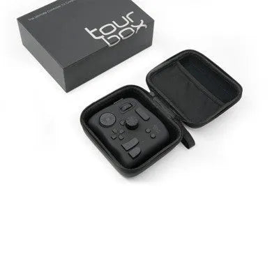 TourBox NEO black digital tablet auxiliary keyboard for video editing on a desk