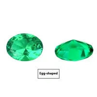 Cultivated emerald gemstone in Columbian green colour showing various polished cuts on a white background.