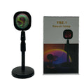 Rechargeable sunset red projection lamp with USB power connection and rainbow lighting effects
