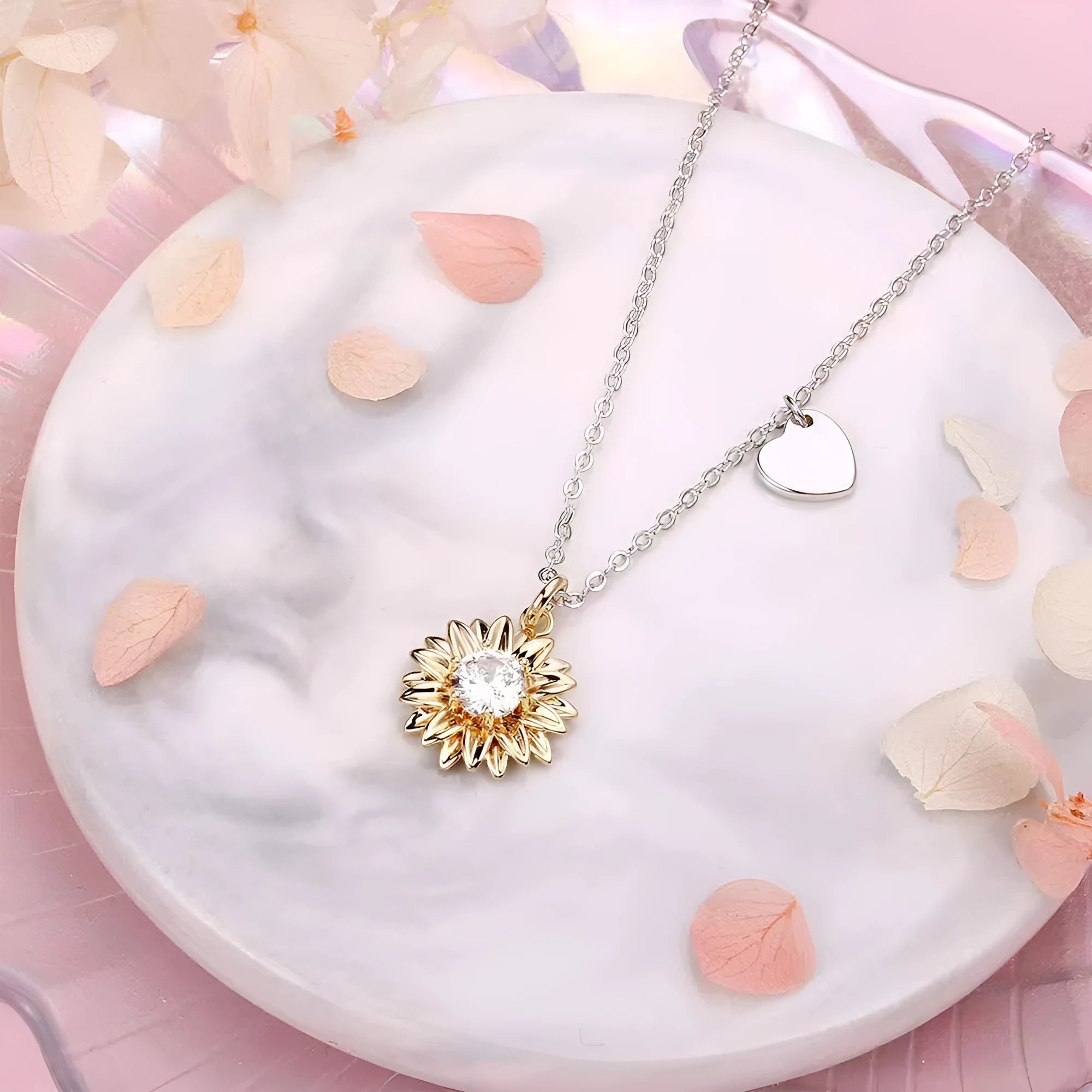 Sterling silver sunflower necklace with geometric daisy petal pendant on an adjustable cross chain.