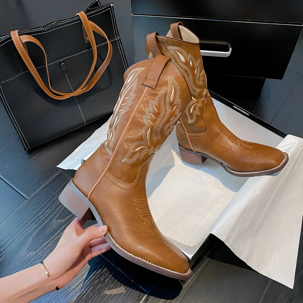 Brown women's mid-calf boots with embroidered pattern, square heel, and leather lining