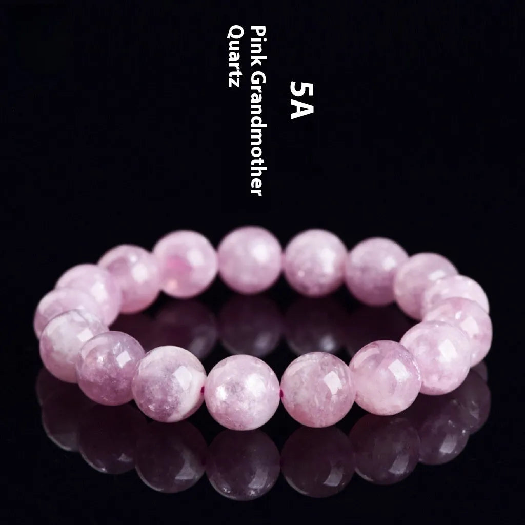 Grandmother Crystal bracelet with purple geometry-shaped beads on a wrist.