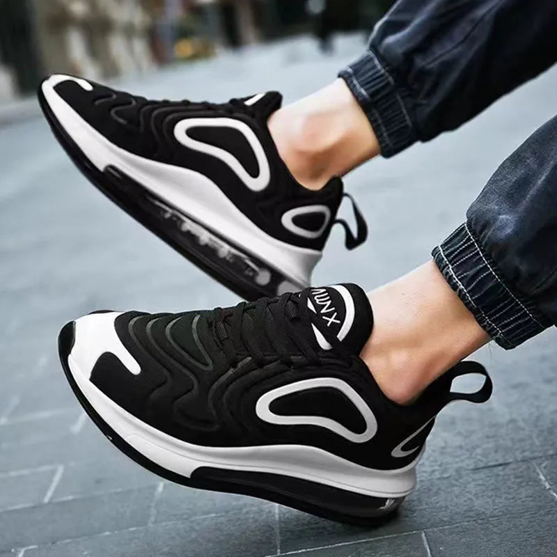 Men's black thick sole lace-up sneakers with a round toe and low-cut design.
