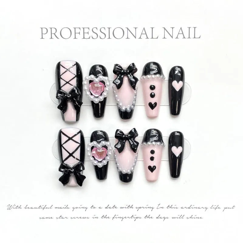Black and pink hand-painted heart design detachable manicure showing bow pattern and size options