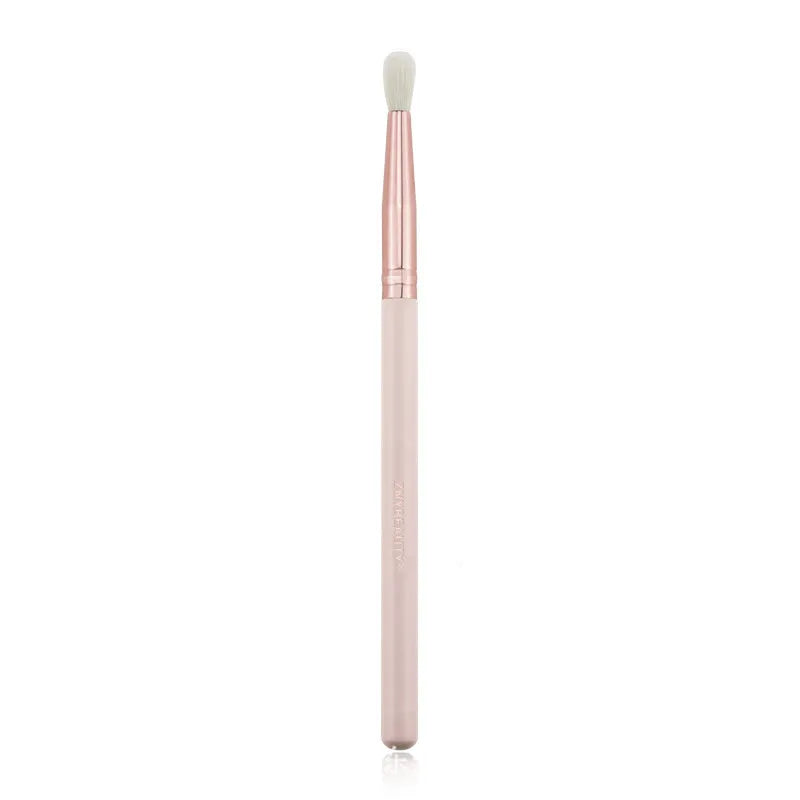 26 pink makeup brushes with wood handles arranged in a PU travel pouch.