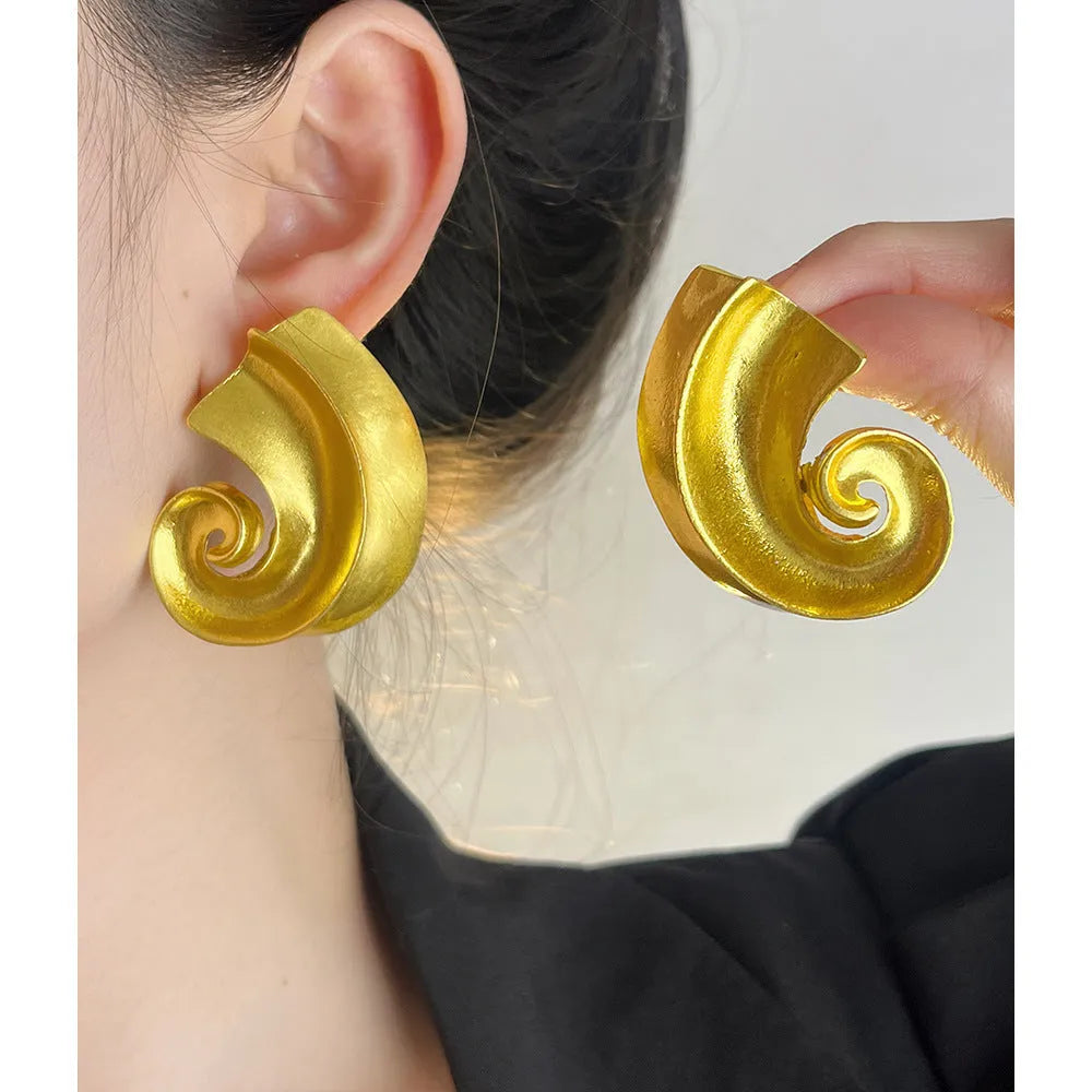 Geometric drop ear studs with retro design in gold or silver finish measuring 5cm length