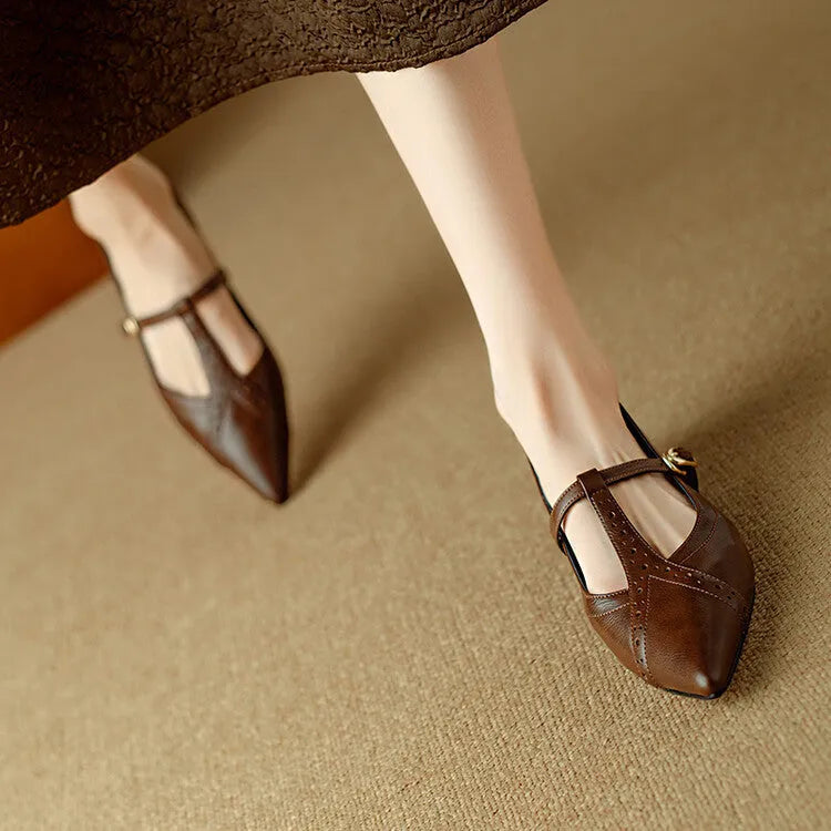 Brown women's low-cut cowhide leather flat shoes with a round toe and soft sole on a white background.