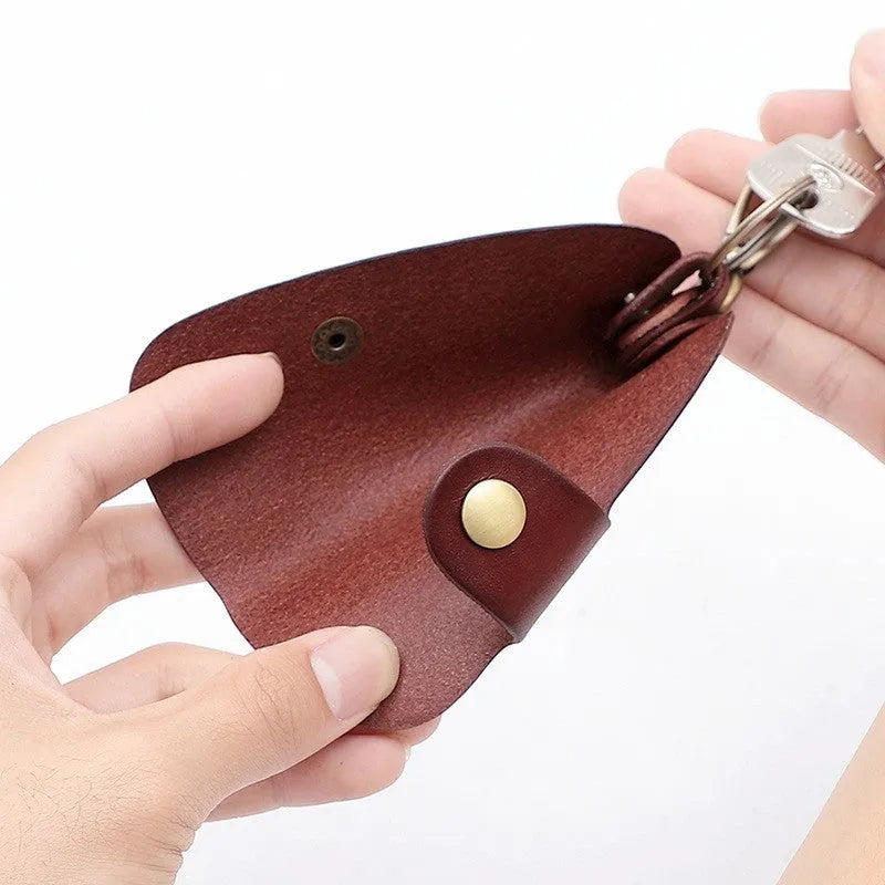 Handmade genuine leather key case for car keys in short length on a table