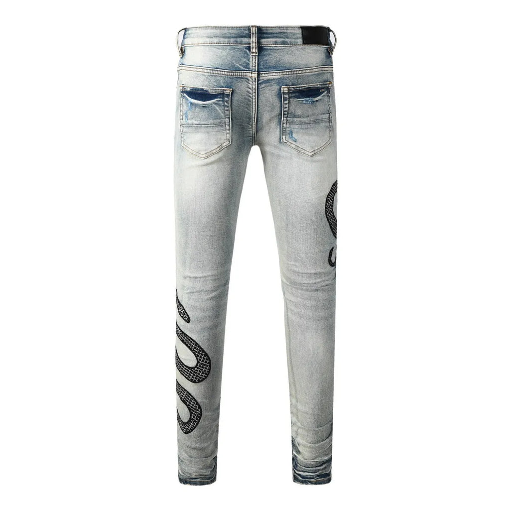 Men's blue distressed skinny jeans with a wash effect and button fly