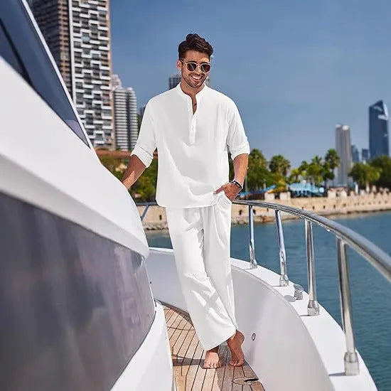 Men's solid colour cotton suit with long sleeve top and trousers in beige, shown laid flat