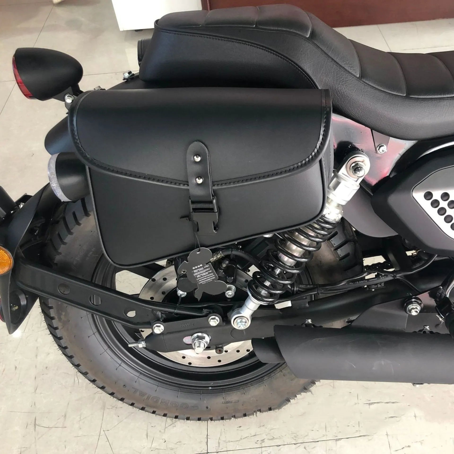 Black PU leather motorcycle swingarm bag for Harley Davidson Sportster showing left and right mounting options