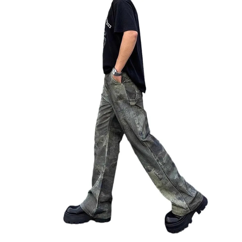 Man wearing retro digital camouflage print straight-leg jeans in cotton denim.