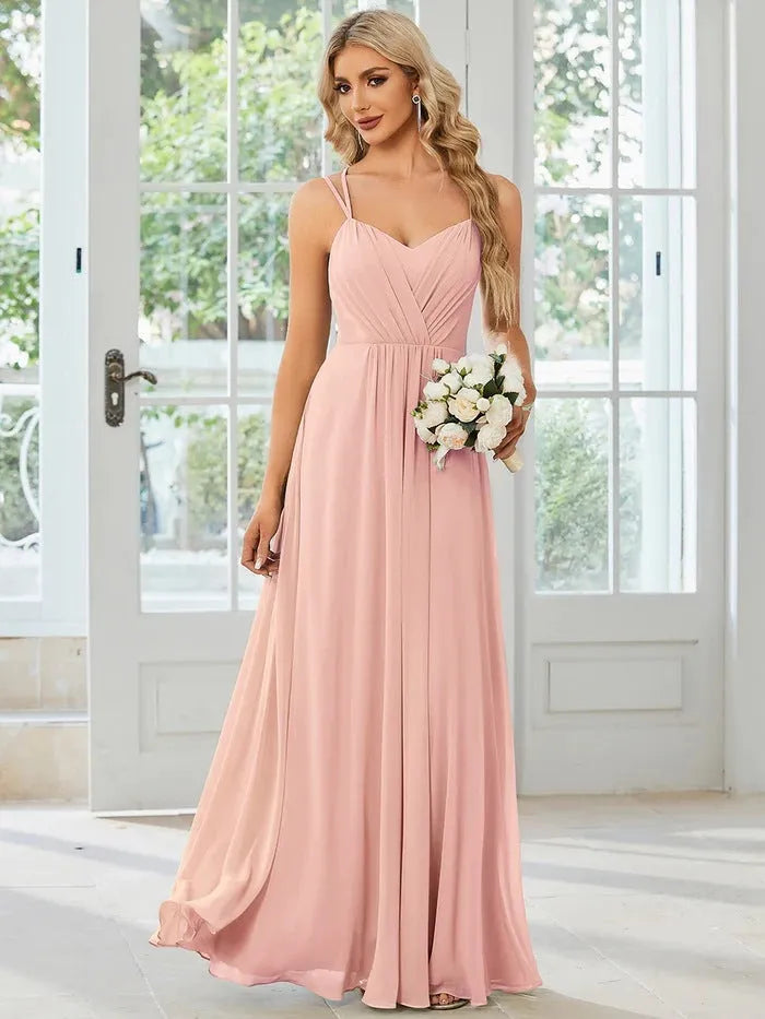 Women's light green sleeveless A-line banquet dress with long pleated skirt on a hanger.