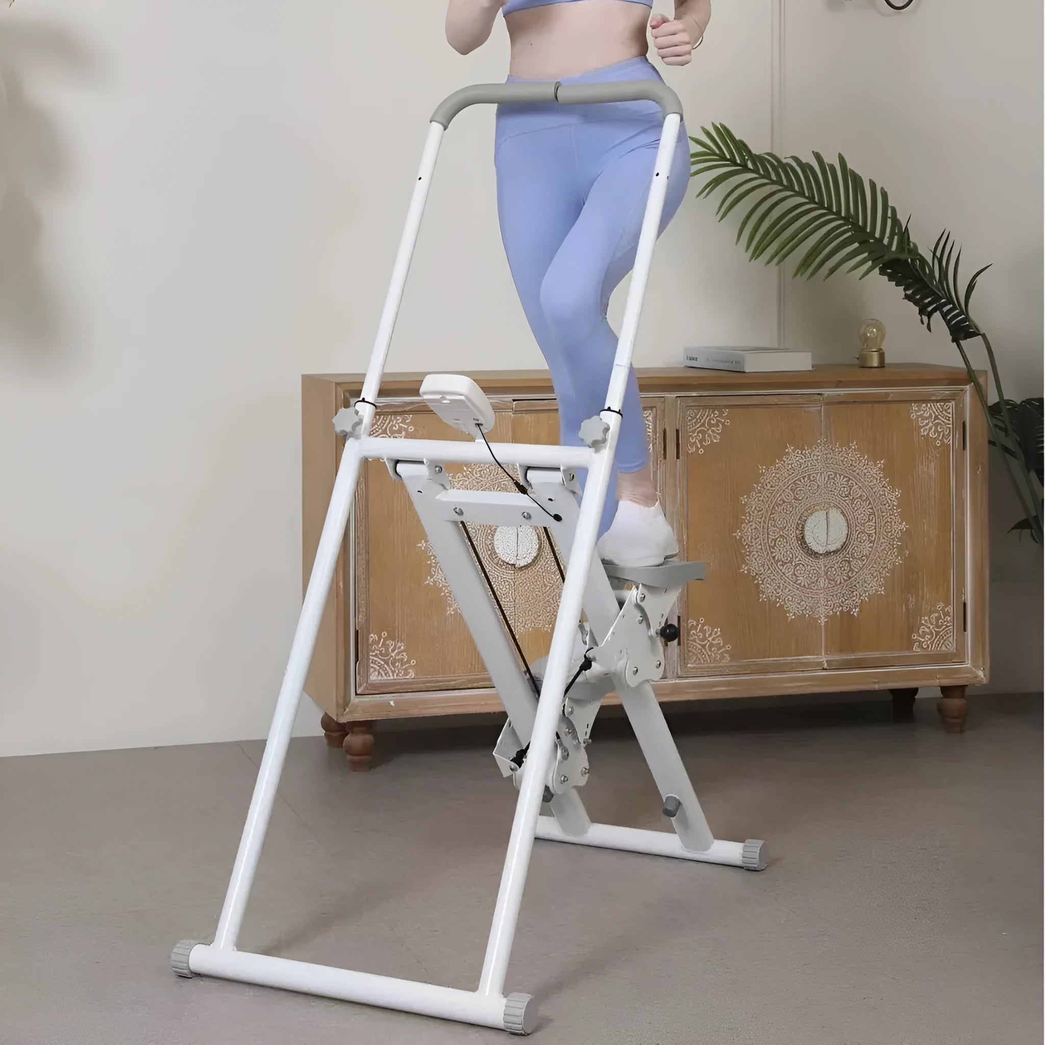 White foldable treadmill with integrated climbing frame for home fitness exercises
