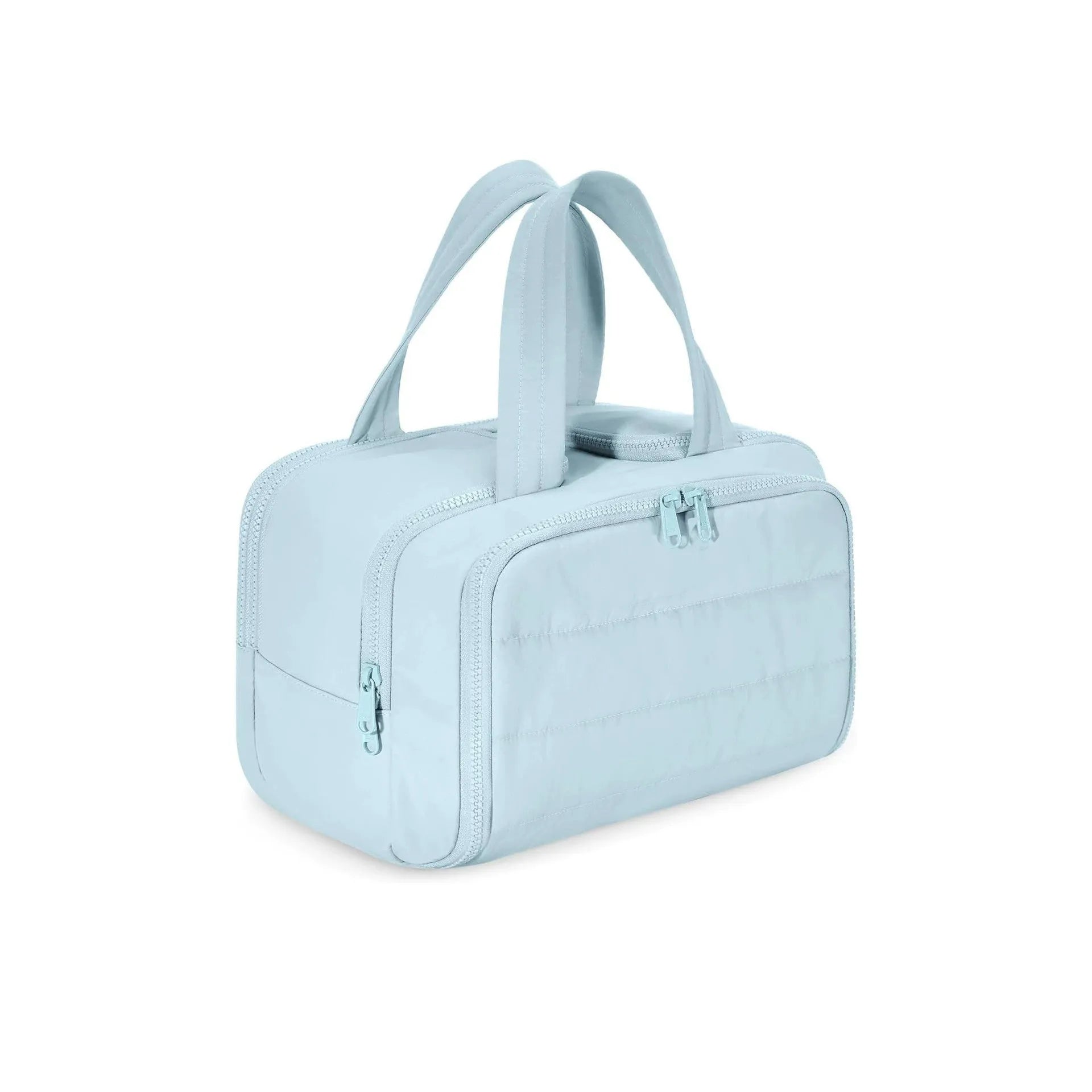Large open-top travel toiletry bag in black polyester with fluffy texture, showing ample storage space.