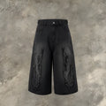 Men's black denim shorts with flame embroidery patch on leg, cropped straight cut style